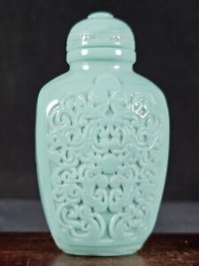 Chinese Flowers And Plants Carved Peking Glass Snuff Bottle