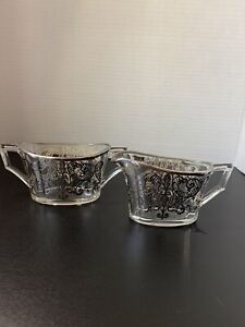 Sugar And Creamer With Silver Inlay Floral Design And Rims