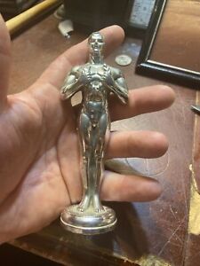 Vintage Early Tropy Topper Man Holding Reef On His Chest Made By Trophies Inc 