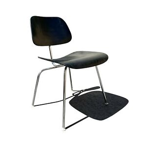 A Black Mid Century Modern Eames Dcm Chair
