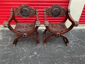 Pair Of Carved Mahogany Leather X Frame Arm Chairs