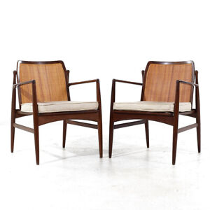 Kofod Larsen For Selig Mid Century Walnut And Cane Lounge Chairs Pair