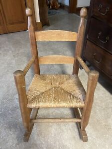 Vintage Solid Oak Child Rocking Chair W Arms And Rush Seat
