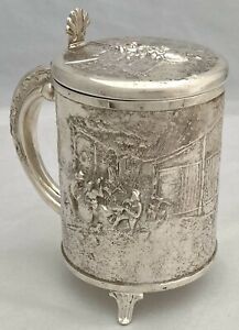 A Northern European Style Silver Plated Lidded Tankard With Relief Detail 